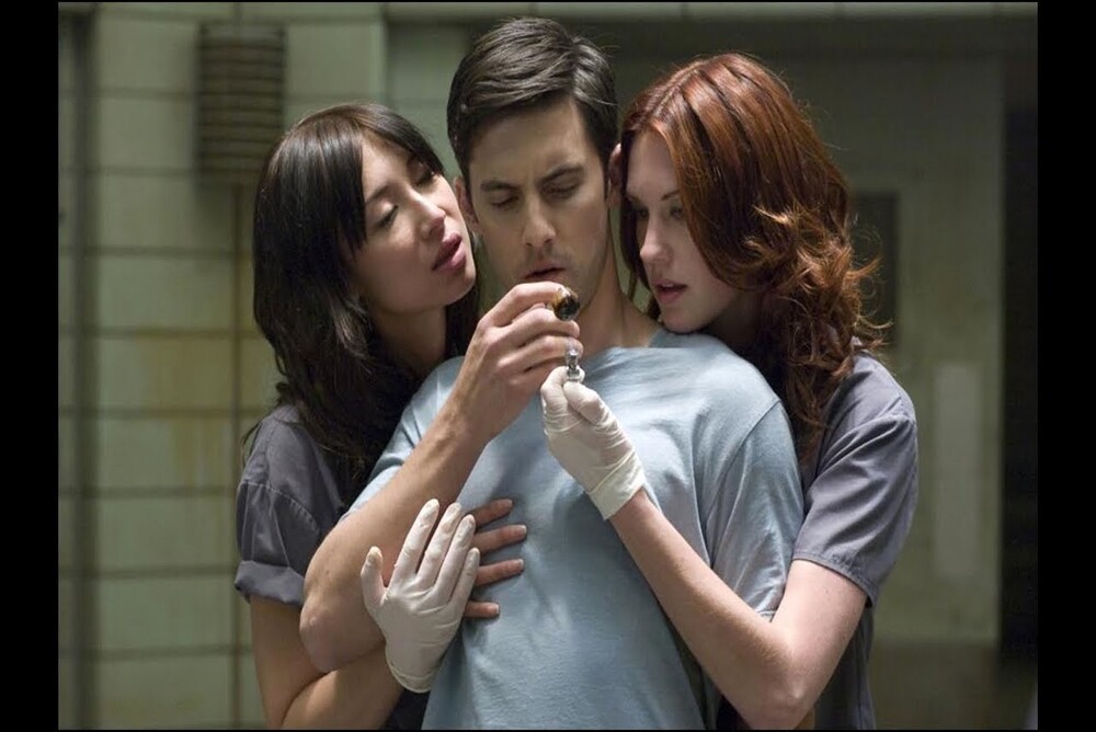 man with two women