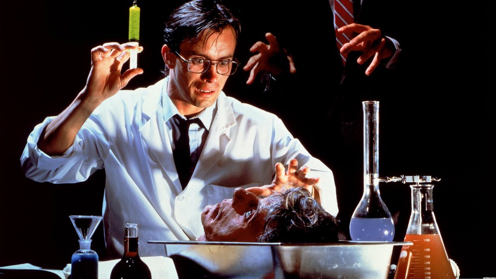 man about to inject another man with green liquid