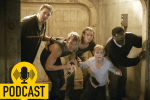 a trapped group of five people look out of a door fearfully.